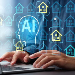 Man using laptop computer to interact with real estate AI platform.