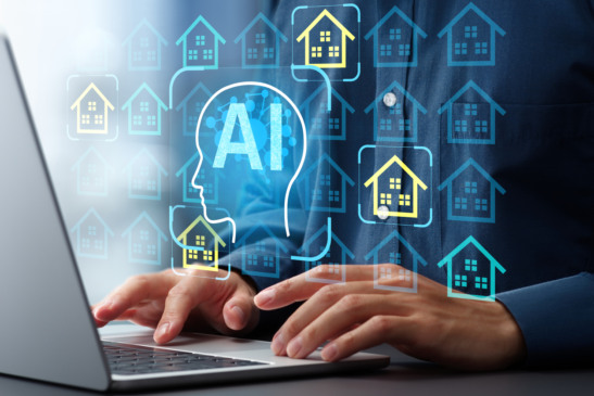Man using laptop computer to interact with real estate AI platform.